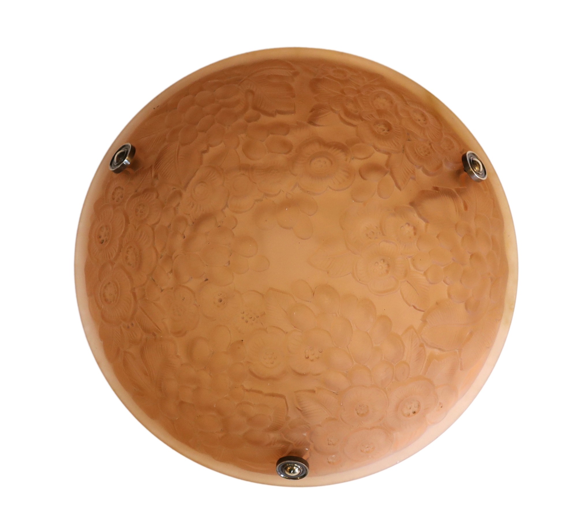 A 1920s-30s French amber glass light bowl moulded with flowers and grapes, with chain set and ceiling rose, diameter 35cm